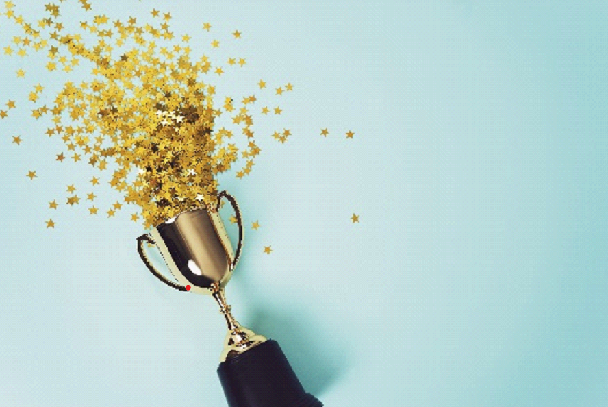 Golden trophy with confetti